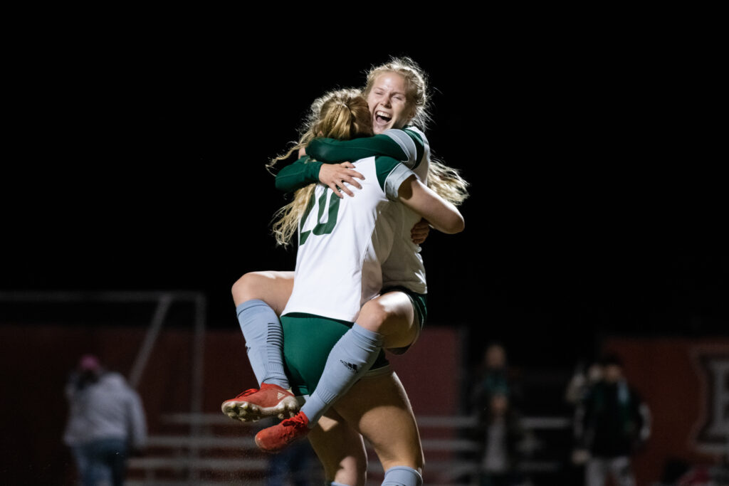 Abby Townsend and Regan Berg celebrating after a cross from Townsend is headed in by Berg tieing the score 2-2 in their game against the Kent State Flashes in Bowling Green at Cochrane Soccer Field on Thursday, Nov. 4, 2021. The Flashes went to win the game 3-2. [Alex Eicher | WOUB]