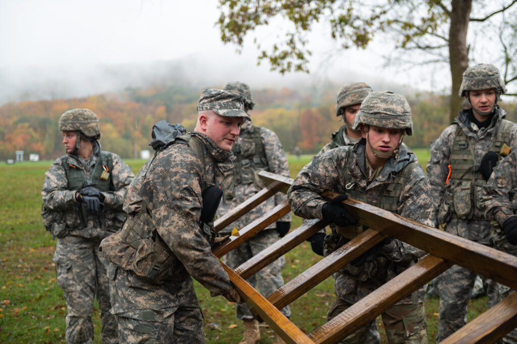 Ohio Army ROTC Cadets manuver a ladder in an attempt to complete an FLRC task.